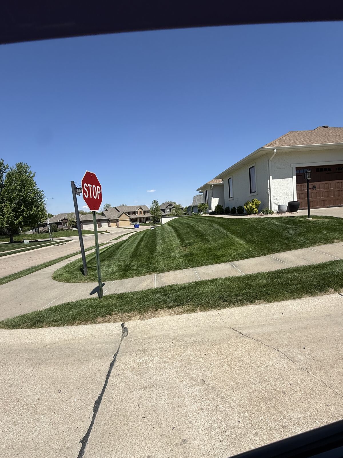 Corner lot lawn stripes in Papillion, NE by Picasso Lawn Care