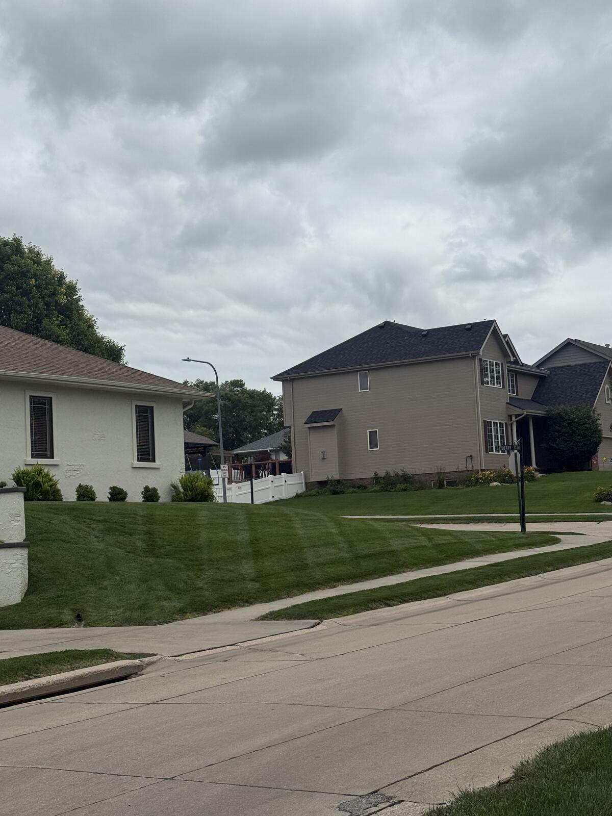 Corner lot lawn stripes in Bellevue, NE by Picasso Lawn Care